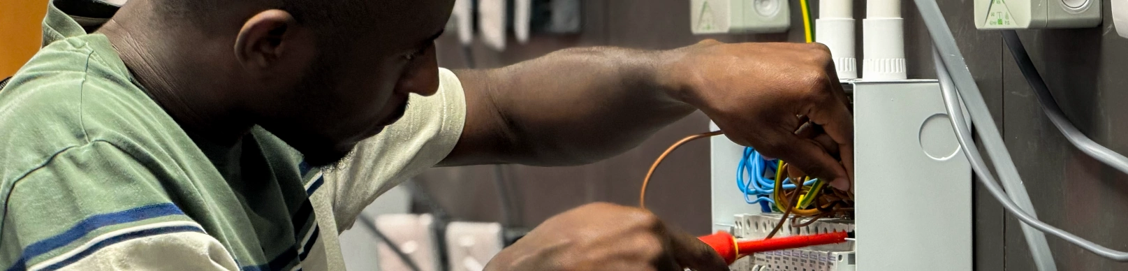 Student wiring a consumer unit at an Access Training electrical open day