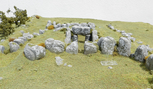 Megalithic tomb model on grass base